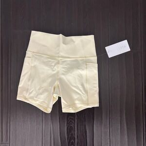 NWT Athleta bike shorts - Butter yellow - Medium